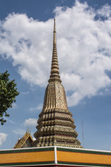 Fototapeta premium Pagoda is in Wat Pho that was named as the temple of the pagoda or chedi that are decorated with yellow glaze or glazed tiles or dark blue