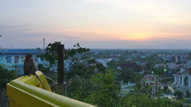 stunning scenery sunset above temple near Khao Chong Krachok in Prajuab Kirikhan province. monkeys come back from the palace on hilltop