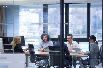 Startup Business Team At A Meeting at modern office building