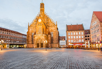 Night view on the illuminated market square with old cathedral in Nurnberg city, Germany