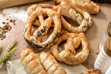 Homemade fresh whole wheat snack pretzels with sesame and salt at local bakery