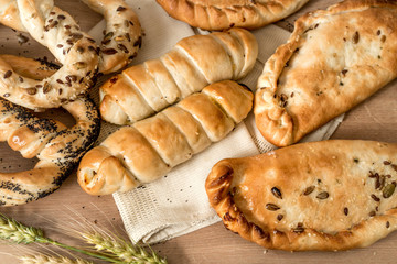 Fresh bakery products, pastry, croissant, pretzels and stuffed puffs at bakery shop