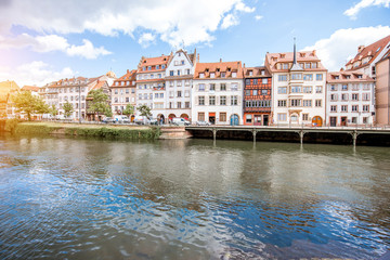 Obraz premium Landscape view on the water channel with beautiful half-timbered houses in Strasbourg city, France