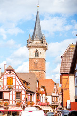 Cityscape view on the old village with medieval tower in Obernai town in Alsace region, France