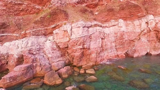 Amazing red coast rocks aerial