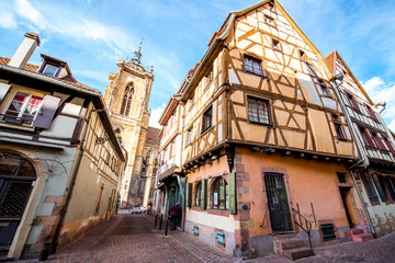 Fototapeta na wymiar View on the beautiful old half-timbered houses during the sunny day in the famous tourist town Colmar in Alsace region, France