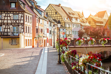 Fototapeta premium Landscape view on the beautiful colorful buildings on the water channel in the famous tourist town Colmar in Alsace region, France