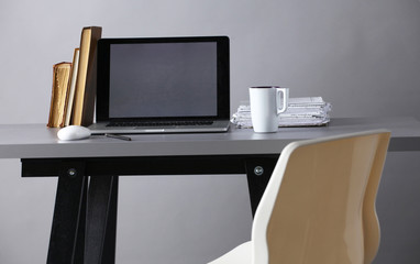 Workspace with computer and document in office