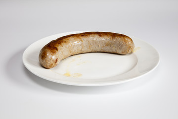 Gebratene Brtawurst und Bratenfett auf einem Teller