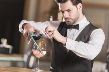 Barman making cocktail