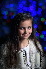 Young girl with ice skating on a winter day