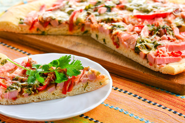 Piece of homemade pizza on a plate