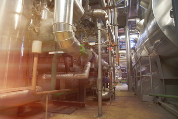 Equipment, cables and piping as found inside of a modern industrial power plant