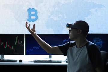 Men controls Bitcoin in virtual reality world