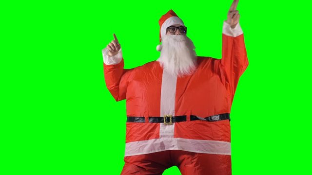 Santa Claus makes funny 70s dance moves. 