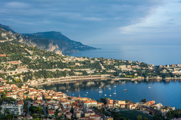 Naklejka na ściany i meble aerial panoramic top view of surrounding hills. view of coastline and beach with blue sky luxury resort and bay with yachts Nice port. Travel in French Riviera