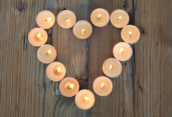 Heart shape made from burning candles