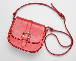 Red leather bag on a white background. Top view.