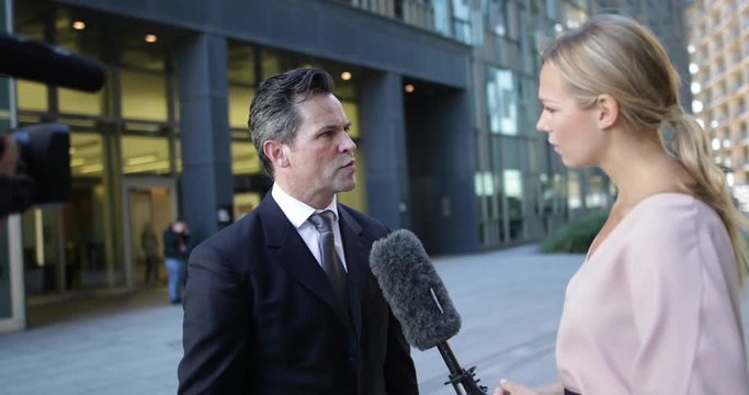 News presenter interviewing live on the street