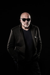 Fototapeta premium A bald man with black glasses.