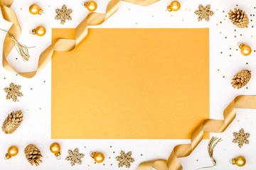christmas or new year frame composition. christmas decorations in gold colors on white background with empty copy space for text. holiday and celebration concept for postcard or invitation. top view