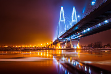Bridge over river. Night illumination of highways. Saint-Petersburg, Russia.