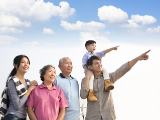 three generations family having fun together outdoors