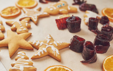 Decorating gingerbread cookies with white icing, selective focus and place for text