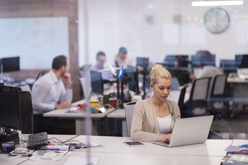businesswoman using a laptop in startup office