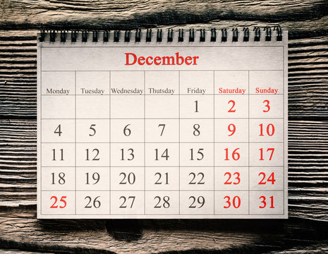 December 25 in the calendar on the wood background
