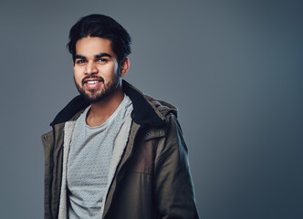 Indian male in a jacket.
