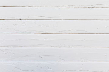 Fototapeta premium Old white wood planks on an old house wall. Newly painted. texture