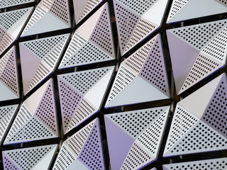 silever geometric steel cladding with angular patterns