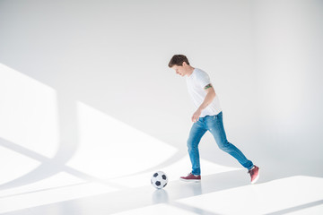 Fototapeta na wymiar young man with soccer ball