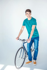 young man with bicycle