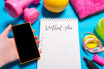 Training equipment with smart phone on blue background