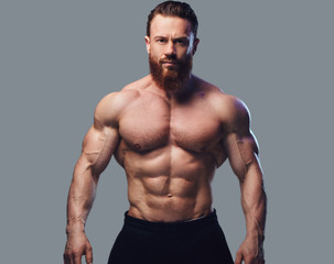 Fototapeta na wymiar Portrait of bearded shirtless bodybuilder.