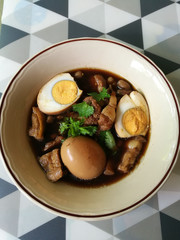 Eggs and porks in brown sauce frogs in a dish