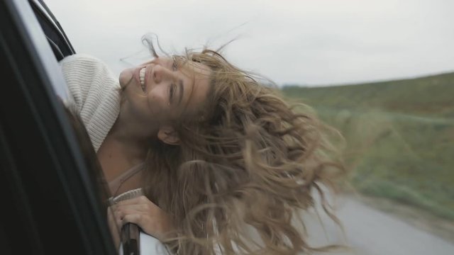 amazing young playful open-minded woman enjoying her voyage, laughing, looking forward