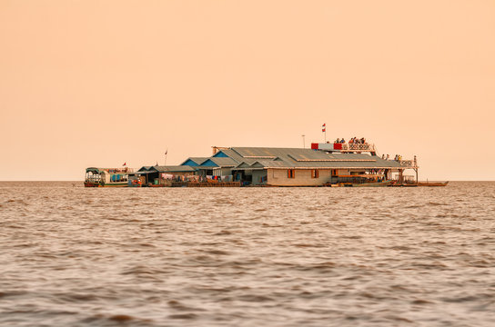 Tourists in floating village on Lake Tonle Sap