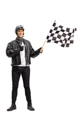 Biker waving a checkered race flag and pointing © Ljupco Smokovski