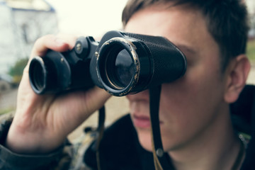 Fototapeta na wymiar Hunter with binoculars