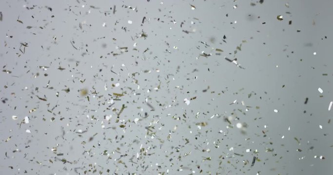 Christmas festive sparkly confetty falling down isolated on white