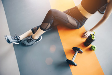 Asian woman exercising in the gym, Young woman workout in fitness for her healthy and office girl lifestyle.