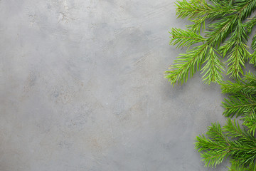 Gray concrete background with Christmas tree. Beautiful Christmas background. Flat lay, top view