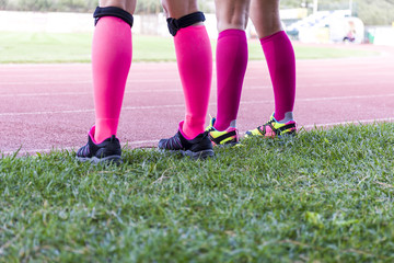 female legs wearing sport equipment