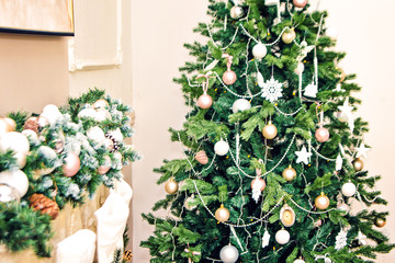 Fototapeta na wymiar New Year Christmas decor interior room of fir-tree and fireplace festive accessories