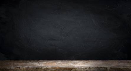 Old wood table top with smoke in the dark background.