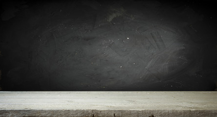 Old wood table top with smoke in the dark background.
