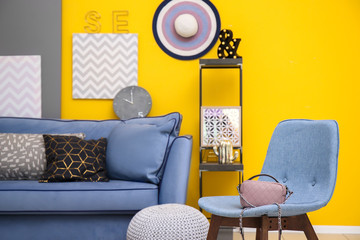 Modern interior with comfortable sofa and chair